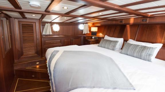 Enjoy the luxury of the spacious double cabin on Gulet Primadonna with ample storage space.